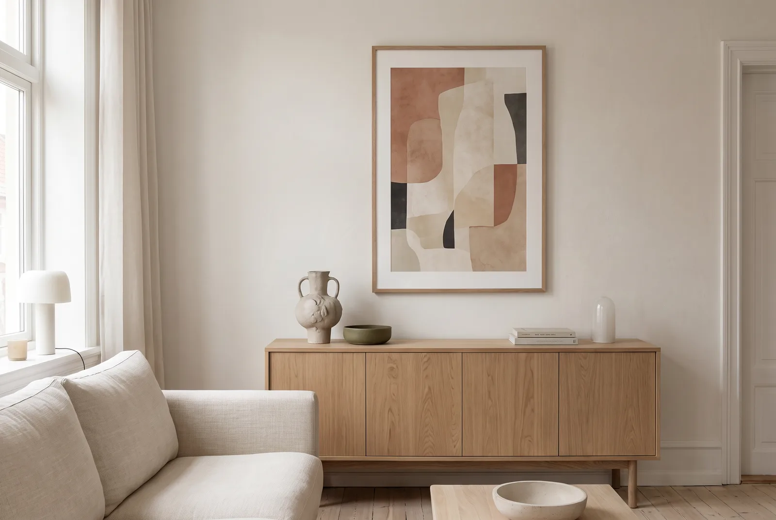 A living room with a framed print on the wall